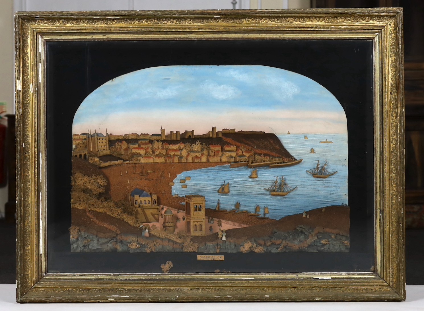 A large framed Victorian cork work panel depicting a view of Scarborough harbour, 93x124cm including frame overall 75 x 105cm